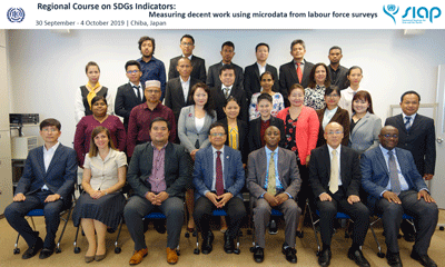 a group of people in business attire posing for a photo