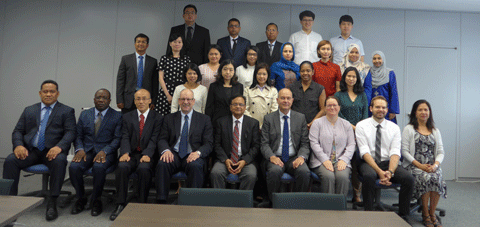 a group of people in business attire posing for a photo