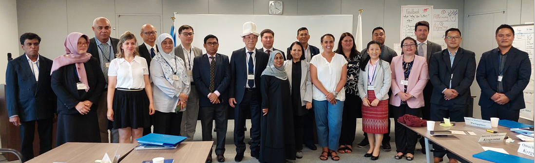 People standing in front of a classroom.