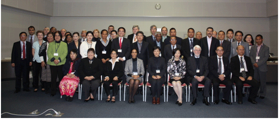 a group photo of people in business attire