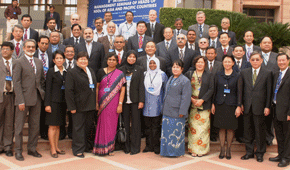 a group of people in business attire posing for a photo